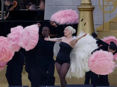 paris olympics opens with rainy spectacle celine dion amid tight security